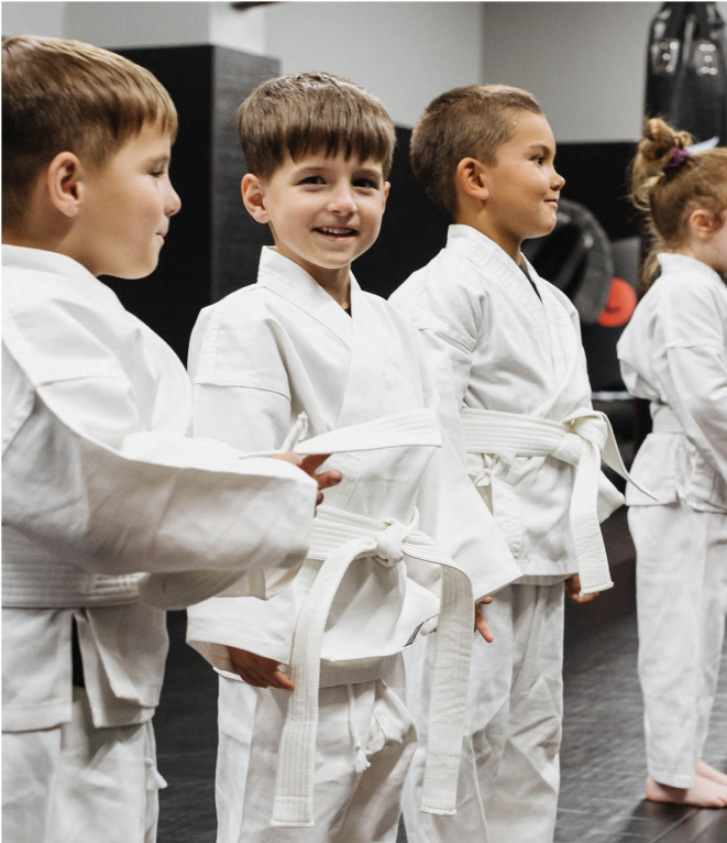 young boys in martial arts uniforms